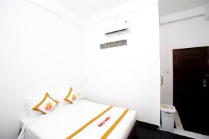 Postel nebo postele na pokoji v ubytování The Rice 131 Bui Vien Hotel