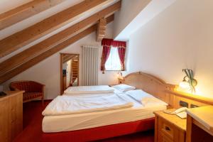 Posteľ alebo postele v izbe v ubytovaní Hotel Laurin