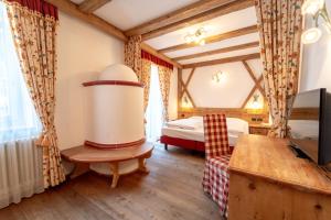 Posteľ alebo postele v izbe v ubytovaní Hotel Laurin