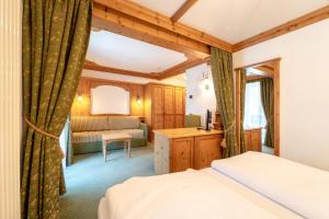 Posteľ alebo postele v izbe v ubytovaní Hotel Laurin