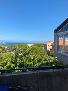 a view of the ocean from a balcony at Trilocale vista mare in Lumio
