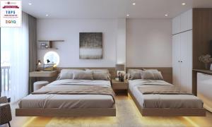 Voodi või voodid majutusasutuse Le Petit Hotel & Travel toas
