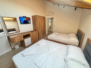Katil atau katil-katil dalam bilik di Brian Hotel