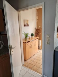 an open door to a kitchen with a counter at Kleine Wohnung an der Werra in Witzenhausen