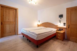 Posteľ alebo postele v izbe v ubytovaní Hotel Laurin