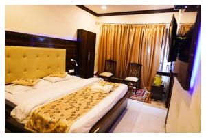 Ένα ή περισσότερα κρεβάτια σε δωμάτιο στο Hotel Temptation Ultimate Prayagraj AC NR NON AC Both Room
