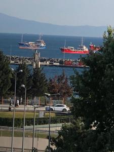 a white car driving down a street with ships in the water at Langa Esra in Istanbul