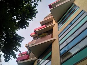 a building with balconies on the side of it at Chandru De Green in Chennai