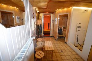 a hallway with a bathroom with a toilet in it at Haus Mühlentrift, FeWo 08 in Döse