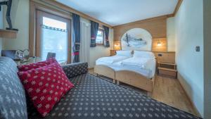 Postel nebo postele na pokoji v ubytování Hotel Crosal + 37 fotografií
