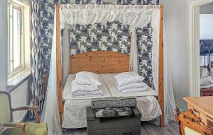 Postel nebo postele na pokoji v ubytování 3 Bedroom Nice Home In Bastuträsk + 3 fotografie