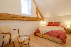 Postel nebo postele na pokoji v ubytování Le bien-aime