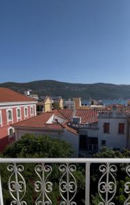a view of a city from a balcony at Philoxenia Apartments in Samos