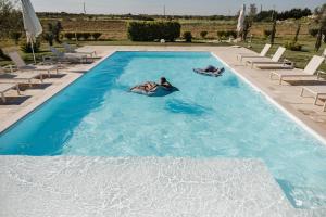 The swimming pool at or close to Villa Topazio