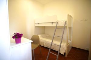 A bed or beds in a room at Villa Topazio