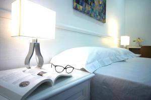 A bed or beds in a room at Villa Topazio
