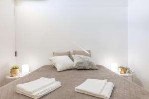 A bed or beds in a room at Villa Topazio