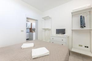 A bed or beds in a room at Villa Topazio