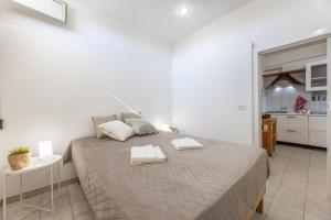A bed or beds in a room at Villa Topazio