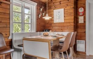 a dining room with a table and chairs at Nice Home In Tarm With Swimming Pool in Tarm