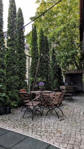 a bench sitting on a patio with a table at Willa Bursztynowa in Rewa +27 photos