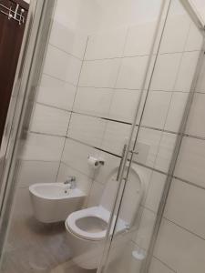 a white bathroom with a toilet and a bidet at Nika's Sea View Oasis in Seget +19 photos