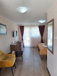 Televízia a/alebo spoločenská miestnosť v ubytovaní Apartments Kozjan