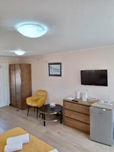Televízia a/alebo spoločenská miestnosť v ubytovaní Apartments Kozjan