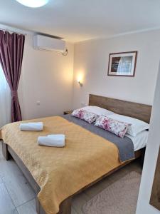 Posteľ alebo postele v izbe v ubytovaní Apartments Kozjan