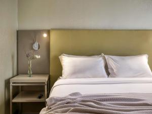 Cama ou camas em um quarto em Mercure Belo Horizonte Lourdes