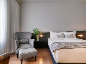 Cama ou camas em um quarto em Mercure Belo Horizonte Lourdes