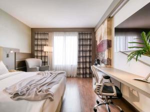 Cama ou camas em um quarto em Mercure Belo Horizonte Lourdes