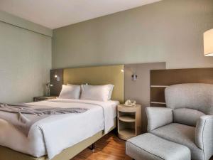 Cama ou camas em um quarto em Mercure Belo Horizonte Lourdes