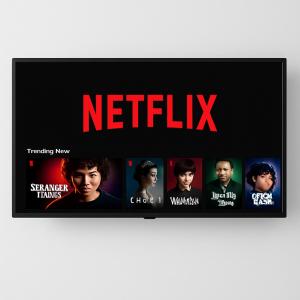 a sign with the netflix logo on a wall at 95 Deluxe London Studios in London