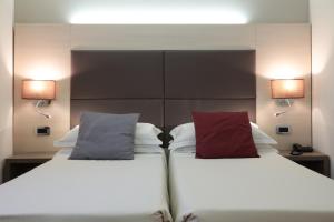 Posteľ alebo postele v izbe v ubytovaní Hotel Campion CityLife