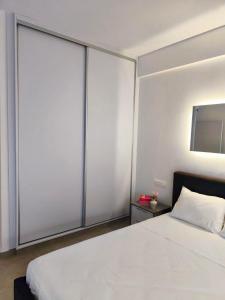 Ένα ή περισσότερα κρεβάτια σε δωμάτιο στο Joyscape beachfront residence