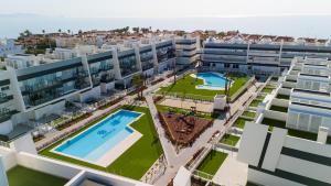 an aerial view of an apartment complex with two swimming pools at Apartment Casa del Sol in Gran Alacant