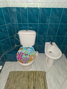 a bathroom with a toilet and a sink at Chalupa u Záhradníkov in Trebostovo +69 photos