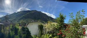 a house with a mountain in the background at Villa Rjukan in Rjukan