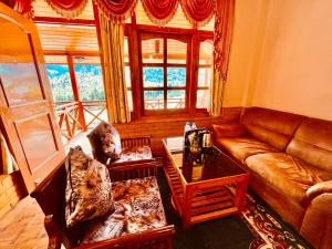 Posezení v ubytování The southern Soul Mountain View Resort, Manali