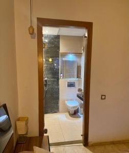 a bathroom with a shower and a toilet at Appartement familial in Casablanca
