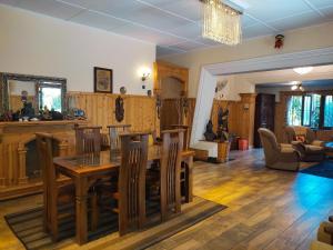 a living room with a wooden table and chairs at Secret Garden Villa Bandarawela in Bandarawela