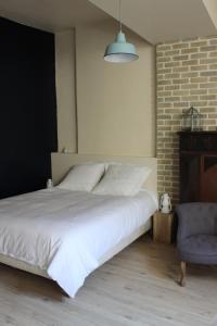 Postel nebo postele na pokoji v ubytování Le Petit Beurre - Studio en Hypercentre de Beaune