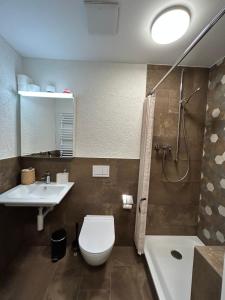 Koupelna v ubytování S-Cape Suite&Spa