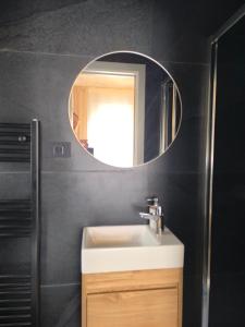 a bathroom with a sink and a mirror at Mari's double bedroom in Umag