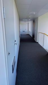 an empty hallway in an office building at Studio apartment in Kuusamo in Kuusamo