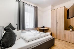 Postel nebo postele na pokoji v ubytování Hotel Montenegro