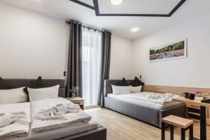 Postel nebo postele na pokoji v ubytování Hotel Montenegro