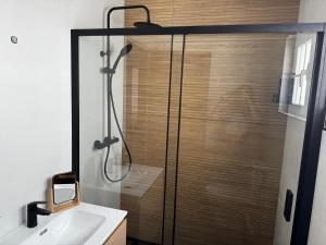 a bathroom with a glass shower with a sink at Baleal Bali Casa da Ilha in Baleal +94 photos