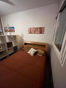 a small bedroom with a bed in a room at Dream's Tower BO in Bologna +13 photos